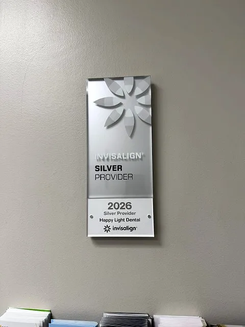 Invisalign Silver Provider 2026 plaque at Happy Light Dental